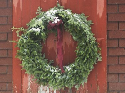 Christmas wreath on red barn door